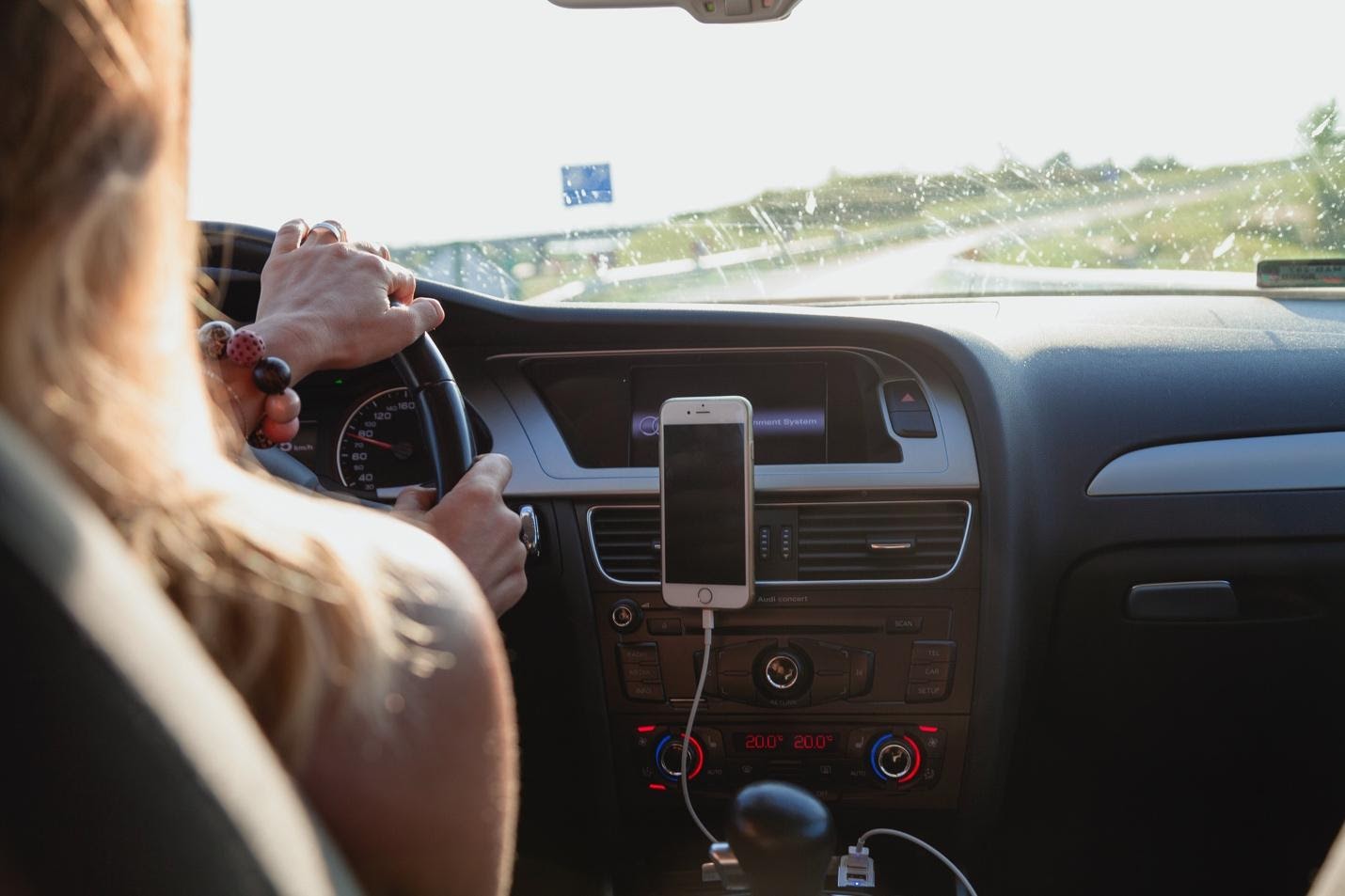 A person in a car Description automatically generated